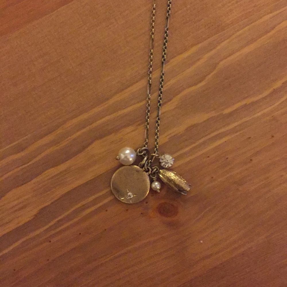 Long gold necklace with charms